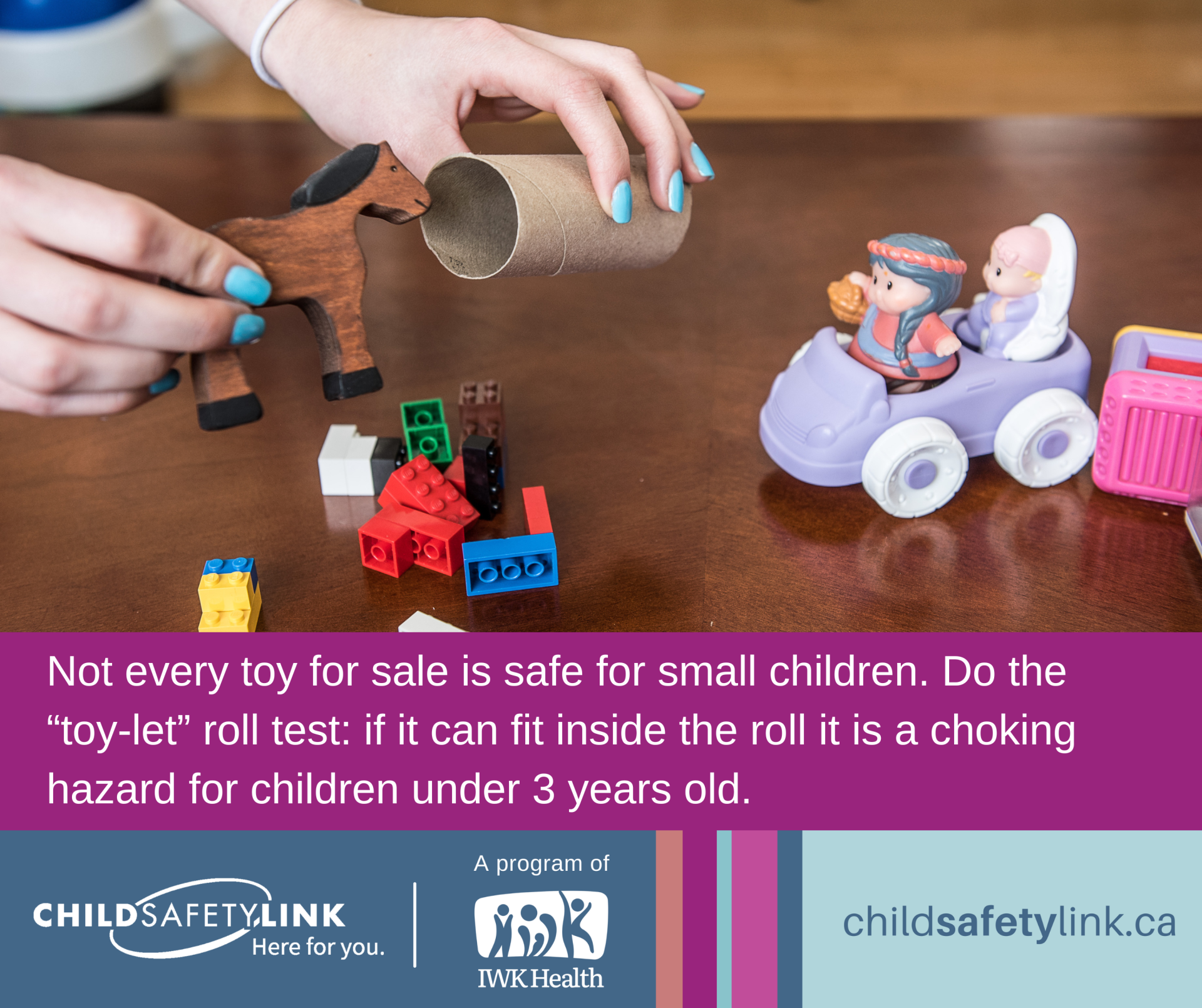 a hand holding a toilet paper roll and some small toys